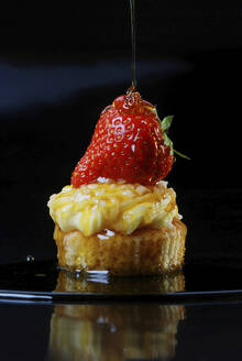 Strawberry and whipped cream on a cupcake - CAIF33615