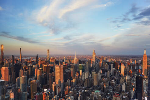 USA, New York, New York City, Aerial view of Manhattan skyscrapers at sunset - TETF02063