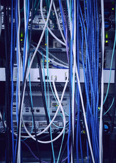 Tangled computer cables in server room - TETF02121