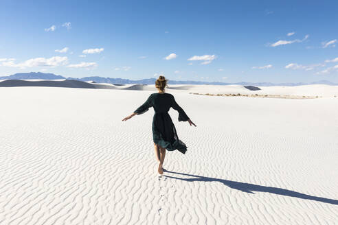 United States, New Mexico, White Sands National Park, Teenage girl dancing - TETF02198