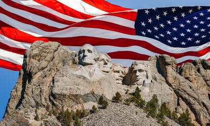 United States, South Dakota, Mount Rushmore with American flag in background - TETF02203