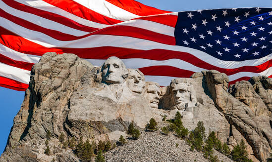 United States, South Dakota, Mount Rushmore with American flag in background - TETF02203