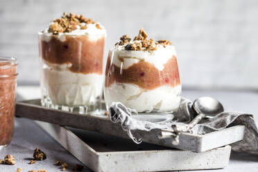 Glasses of healthy sugarfree mascarpone dessert with yogurt, rhubarb and granola - SBDF04635