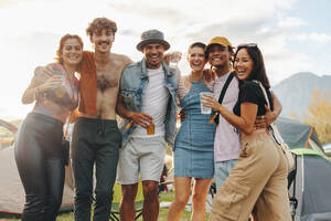 Young individuals radiate happiness as they immerse themselves in the festive atmosphere of a vibrant festival, celebrating life and cherishing joyful moments together. This photo has intentional use of 35mm film grain. - JLPPF02194