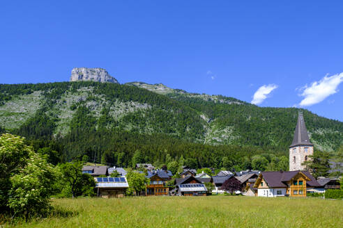 Austria, Styria, Altaussee, Mountain village in summer with hill in background - LBF03827