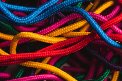 From above of messy mixed colorful shoelaces - ADSF44971