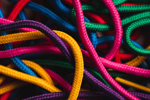From above of messy mixed colorful shoelaces - ADSF44972