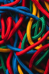 From above of messy mixed colorful shoelaces - ADSF44974