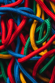 From above of messy mixed colorful shoelaces - ADSF44974