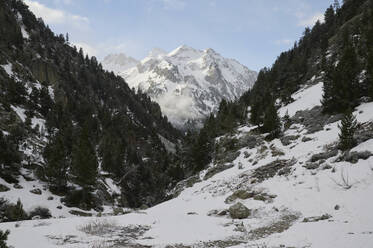 Amazing landscape of massive snowy mountains with high peaks under blue clear sky in sunny winter day in Aragon Pyrenees - ADSF45488