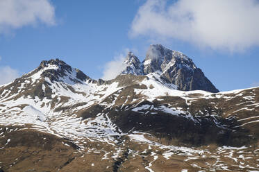 Amazing landscape of massive snowy mountains with high peaks under blue sky in sunny winter day in Pyrenees - ADSF45489