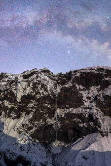 Picturesque view of Urbasa Range covered with snow under majestic starry sky during winter trip through Spain - ADSF45545