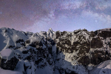 Picturesque view of Urbasa Range covered with snow under majestic starry sky during winter trip through Spain - ADSF45547