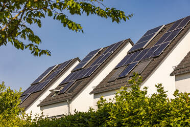 Germany, Baden-Wurttemberg, Solar panels on roofs of modern suburban houses - WDF07342