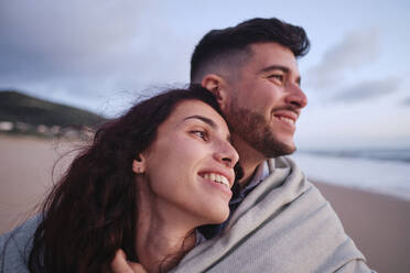 Happy young couple spending leisure time at beach - ASGF04042