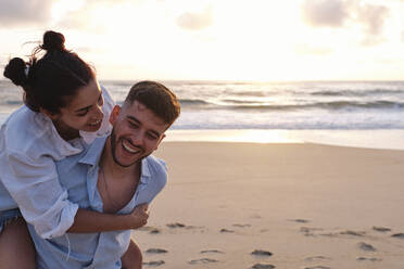 Happy couple having fun at beach - ASGF04049