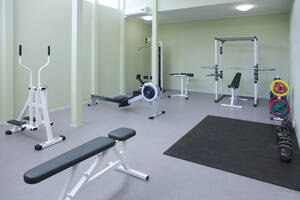 A fitness room, gym equipment, weights and fitness and sports training equipment, in a school. - MINF16646