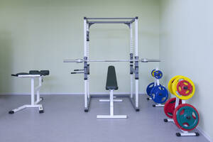 A fitness room, gym equipment, weights and fitness and sports training equipment, in a school. - MINF16647