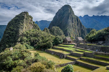 The path to Machu Picchu, the high mountain capital of the Inca tribe, a 15th century citadel site, buildings and view of the plateau and Andes mountains. - MINF16678