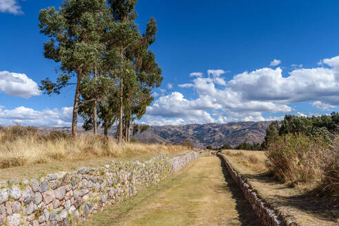 The landscape of the Urubamba province, view over the mountains, and a sunken path with stone walls, an example of the Inca building style. - MINF16684