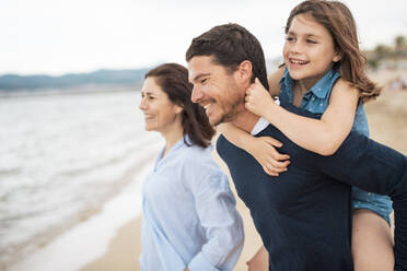 Happy family enjoying vacations together at beach - JOSEF20014