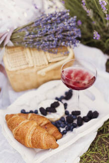 Food and drink with lavender flowers on tray - ONAF00599