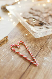 Candy canes on table in kitchen - ONAF00607