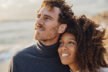 Loving couple spending leisure time at beach - JOSEF20337