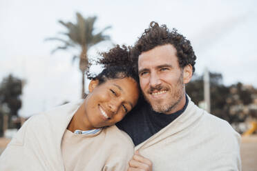 Loving couple spending leisure time together at beach - JOSEF20365