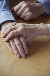 Close-up of senior couple holding hands - RBF09270