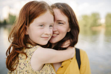 Thoughtful girl with mother in park - SSYF00190