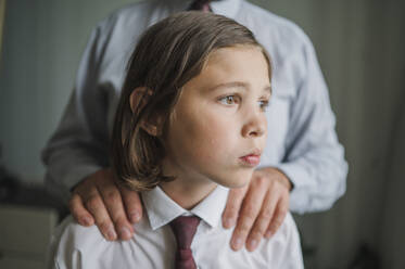 Contemplative son with father at home - ANAF01868