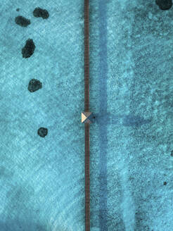 Aerial view of a long jetty across the reef, Nalaguraidhoo Atoll, Maldives. - AAEF19395