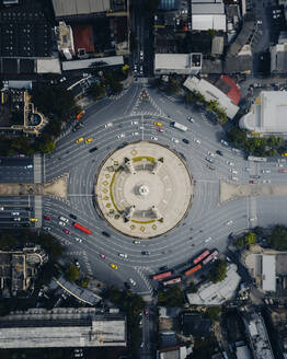 Aerial view of the vehicles driving next to the Democracy Monument at the roundabout in Bangkok downtown, Thailand. - AAEF19413