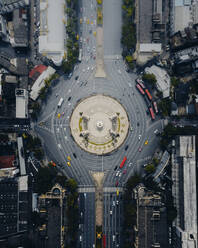 Aerial view of the vehicles driving next to the Democracy Monument at the roundabout in Bangkok downtown, Thailand. - AAEF19414