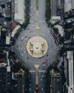 Aerial view of the vehicles driving next to the Democracy Monument at the roundabout in Bangkok downtown, Thailand. - AAEF19414