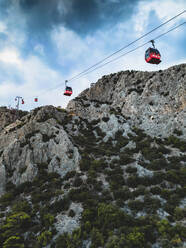 Aerial view of cable car along the mountain crest in Antalya, Turkey. - AAEF19425