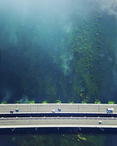 Aerial view of vehicles driving on a bridge over a swamp in Antalya, Turkey. - AAEF19429