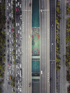 Aerial view of hidden sport field between roads in Bangkok, Thailand. - AAEF19446