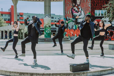 Hip hop crew dancing - Multiracial group of people having fun outdoors - DMDF00495