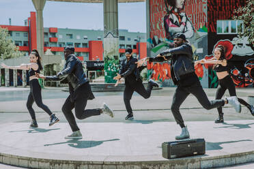 Hip hop crew dancing - Multiracial group of people having fun outdoors - DMDF00496