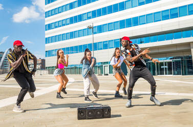Hip hop crew dancing - Multiracial group of people having fun outdoors - DMDF00503