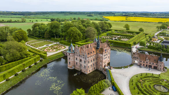 Denmark, Southern Denmark, Kvaerndrup, Aerial view of Egeskov Castle and surrounding park - AMF09941