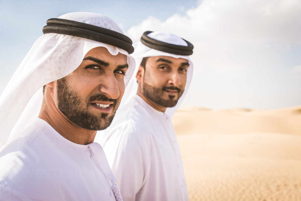 Man Wearing Traditional Uae Clothes Spending Time In The Desert