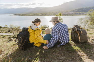 Father and mother spending leisure time with son on vacation - JJF01002