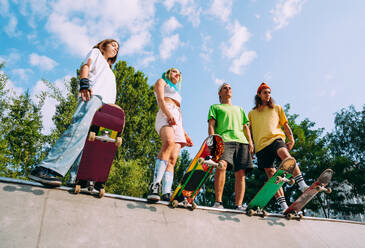 Professional skateboarders having fun at the skate park - DMDF00795