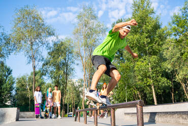 Professional skateboarders having fun at the skate park - DMDF00798