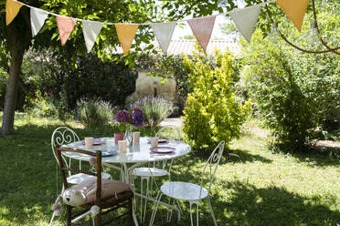 Decorated back yard with table set up - SVKF01581