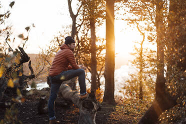 Contemplative man spending leisure time in forest - JOSEF20457