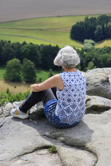 Elderly Woman Taking Picture of Rocks · Free Stock Photo